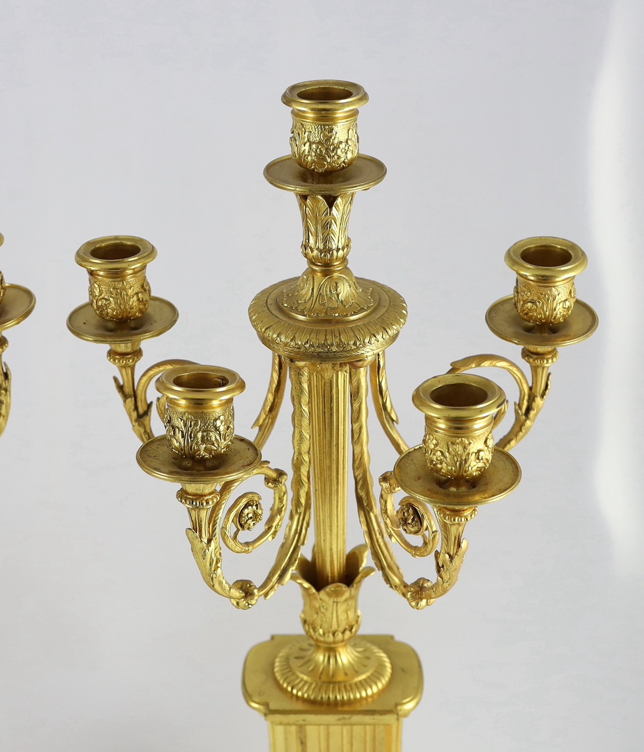 A pair of 19th century French ormolu five light candelabra, 26cm wide, 56cm high